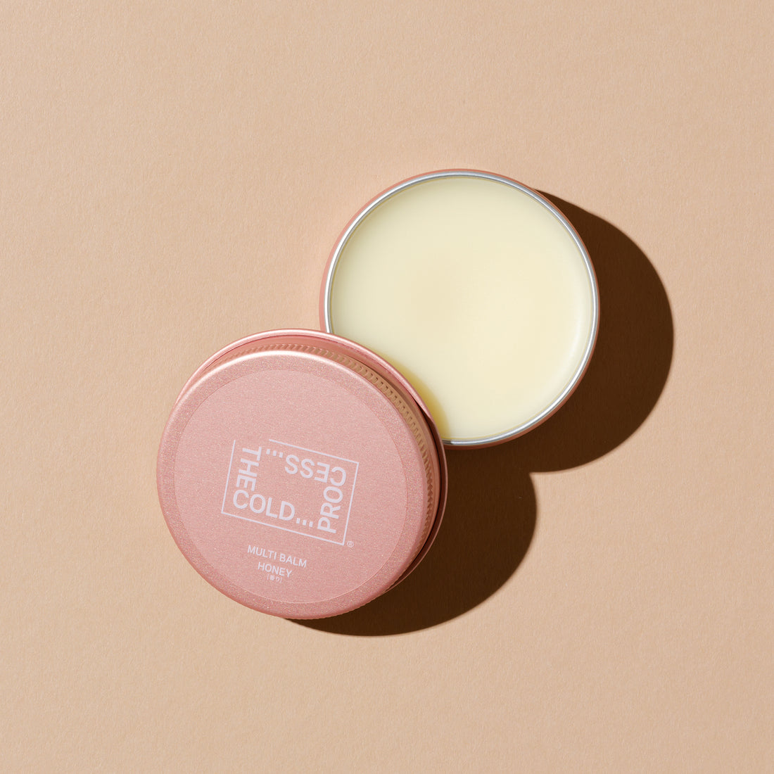 Multi-purpose balm made by a soap specialty store, honey